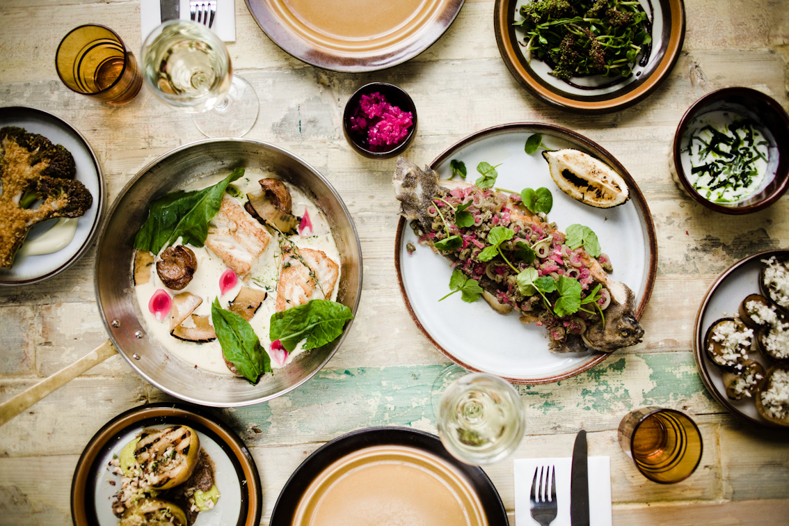 A spread of fish and local vegetables at Slippurinn