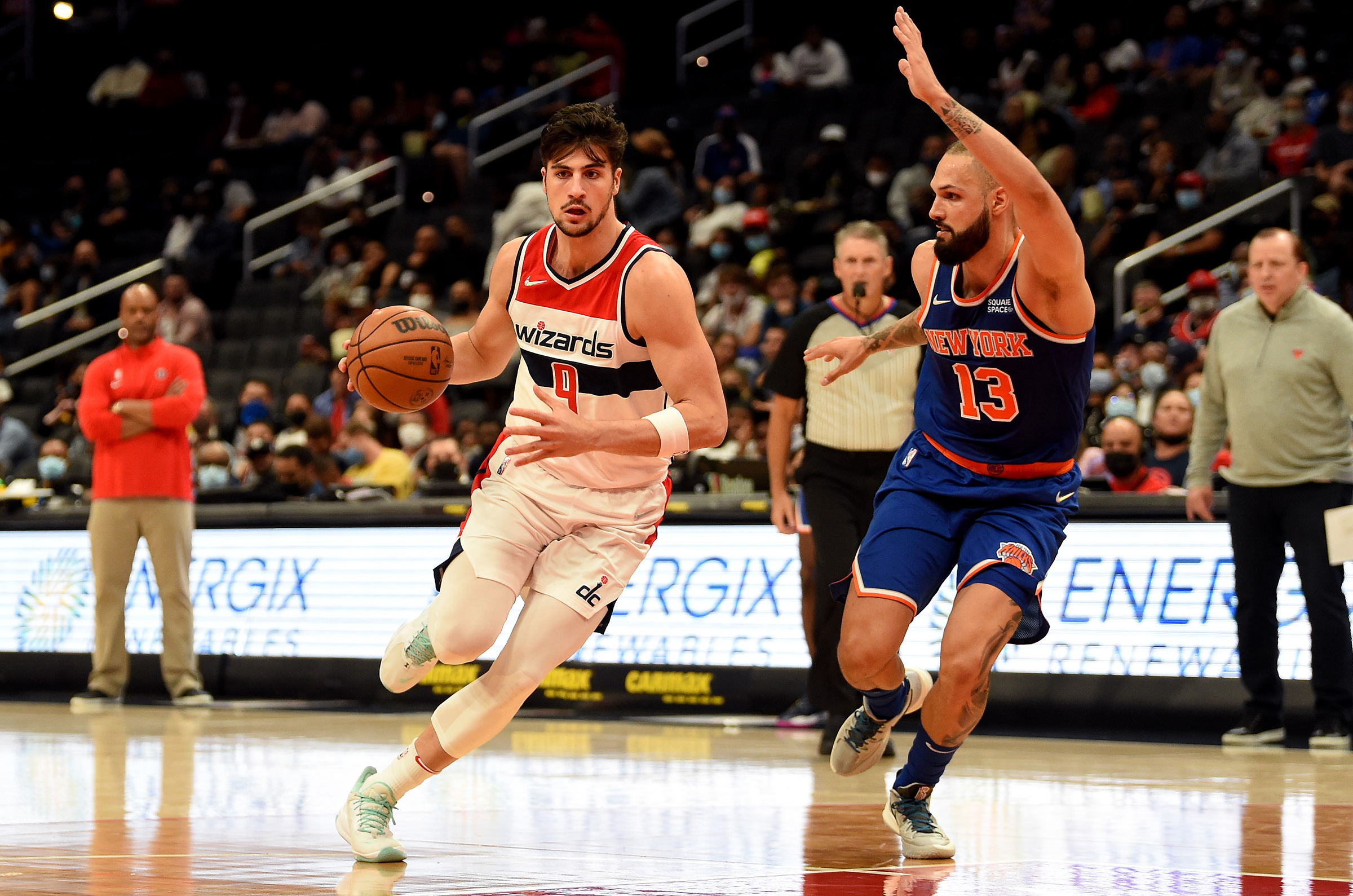  Deni Avdija #9 of the Washington Wizards handles the ball in the second half against Evan Fournier #13 of the New York Knicks at Capital One Arena on October 09, 2021 in Washington, DC.