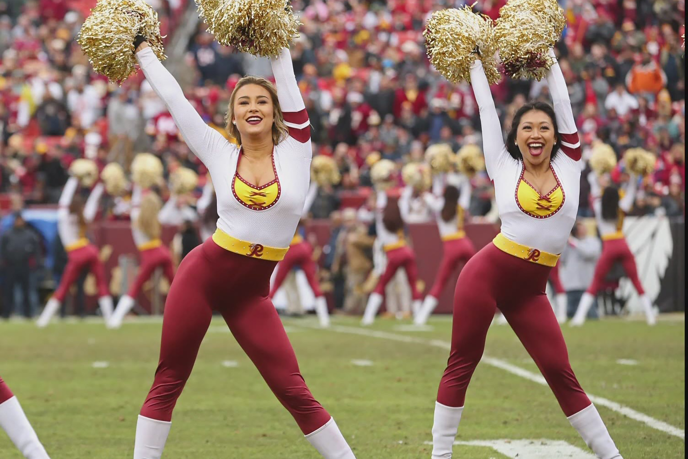 Washington Football Team's dancers cheer at a game.