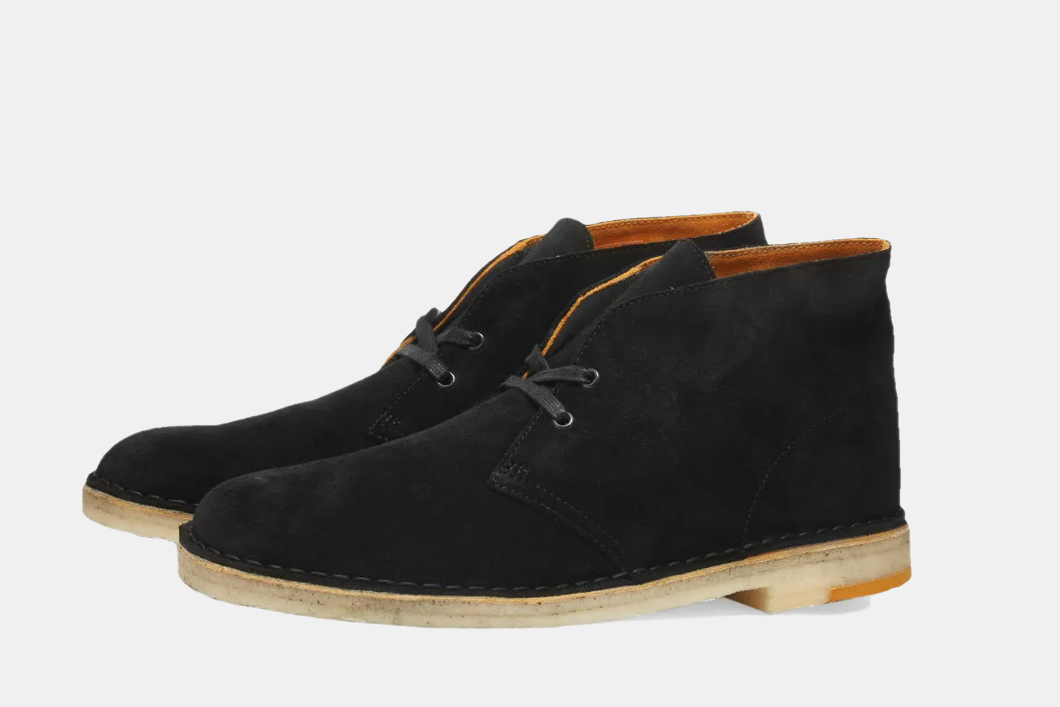 a sleek black desert boot