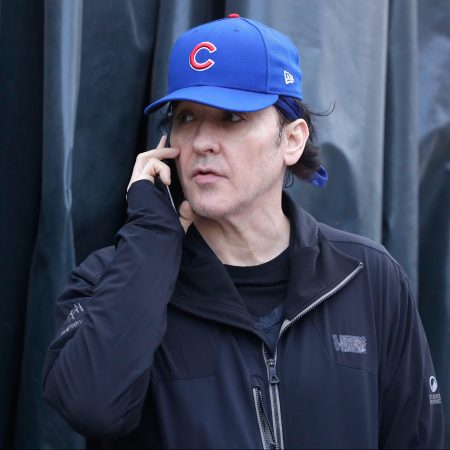 John Cusack stands outside Wrigley Field in Game Three of the 2016 World Series between the Chicago Cubs and the Cleveland Indians at Wrigley Field on October 28, 2016 in Chicago, Illinois. A member of Barstool Sports recently tried to confront the actor about his dual Cubs/White Sox fandom