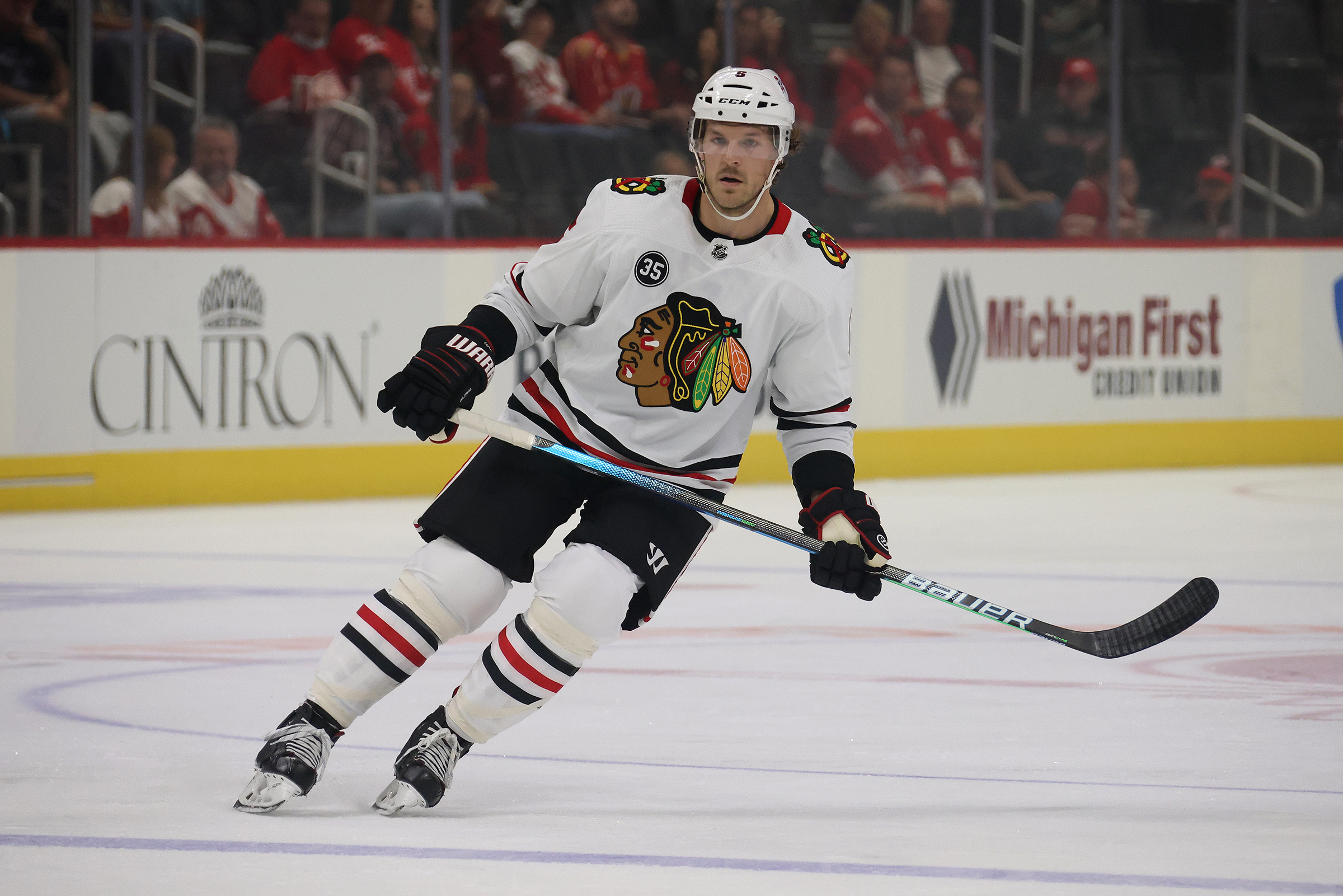 Jake McCabe #6 of the Chicago Blackhawks skates against the Detroit Red Wings during a preseason game at Little Caesars Arena on October 04, 2021 in Detroit, Michigan