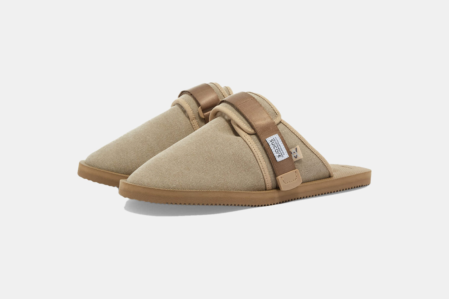 a pair of beige, slide-inspired mules