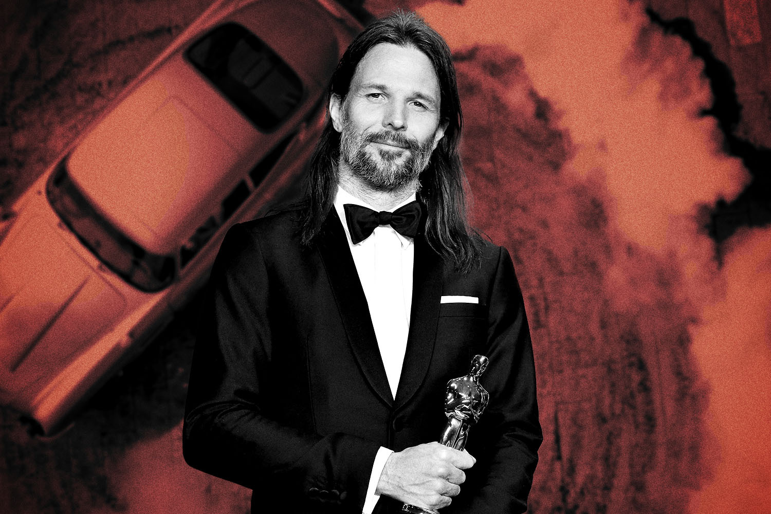 No Time to Die cinematographer Linus Sandgren holding the Oscar he won for La La Land, with James Bond's Aston Martin DB5 driving in the background