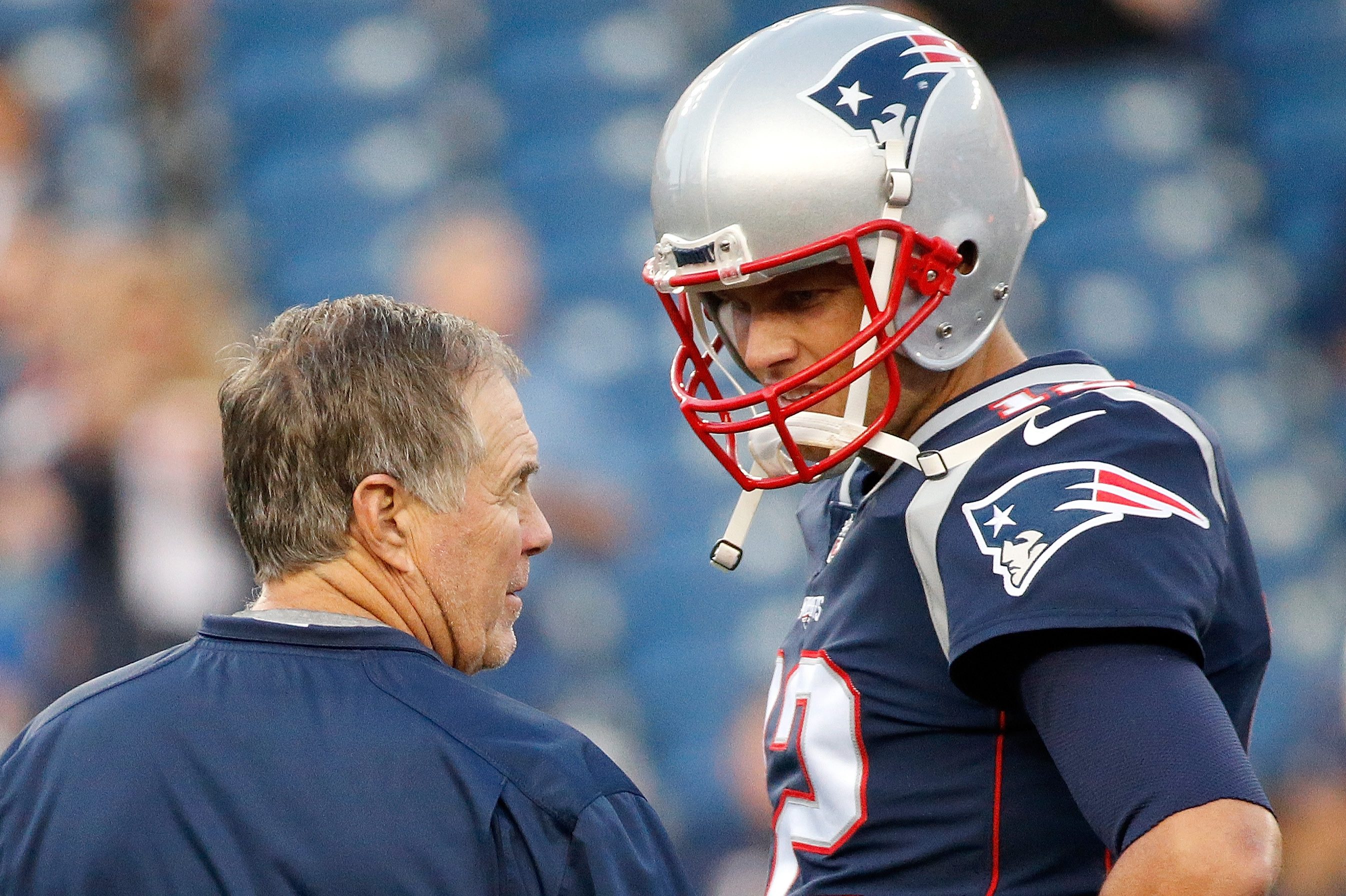 Bill Belichick and Tom Brady chat before a preseason game in 2017