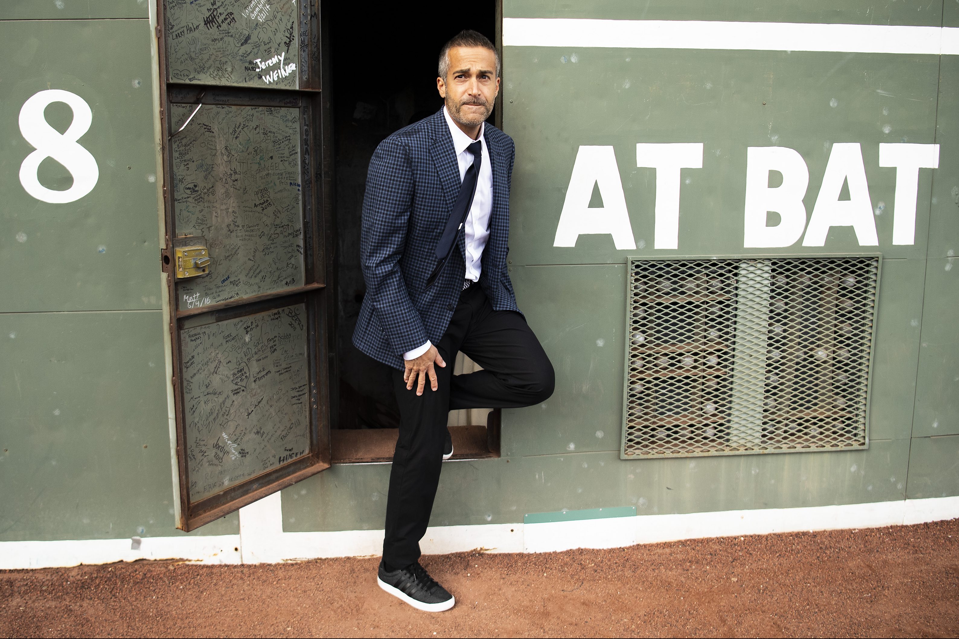 Baseball color commentator Matt Vasgersian exits the Green Monster at Fenway Park