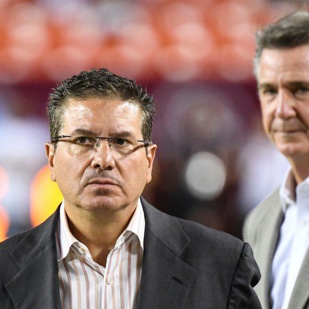 WFT owner Dan Snyder paces the sidelines in front of former general manager Bruce Allen at a game against the Chicago Bears in 2019