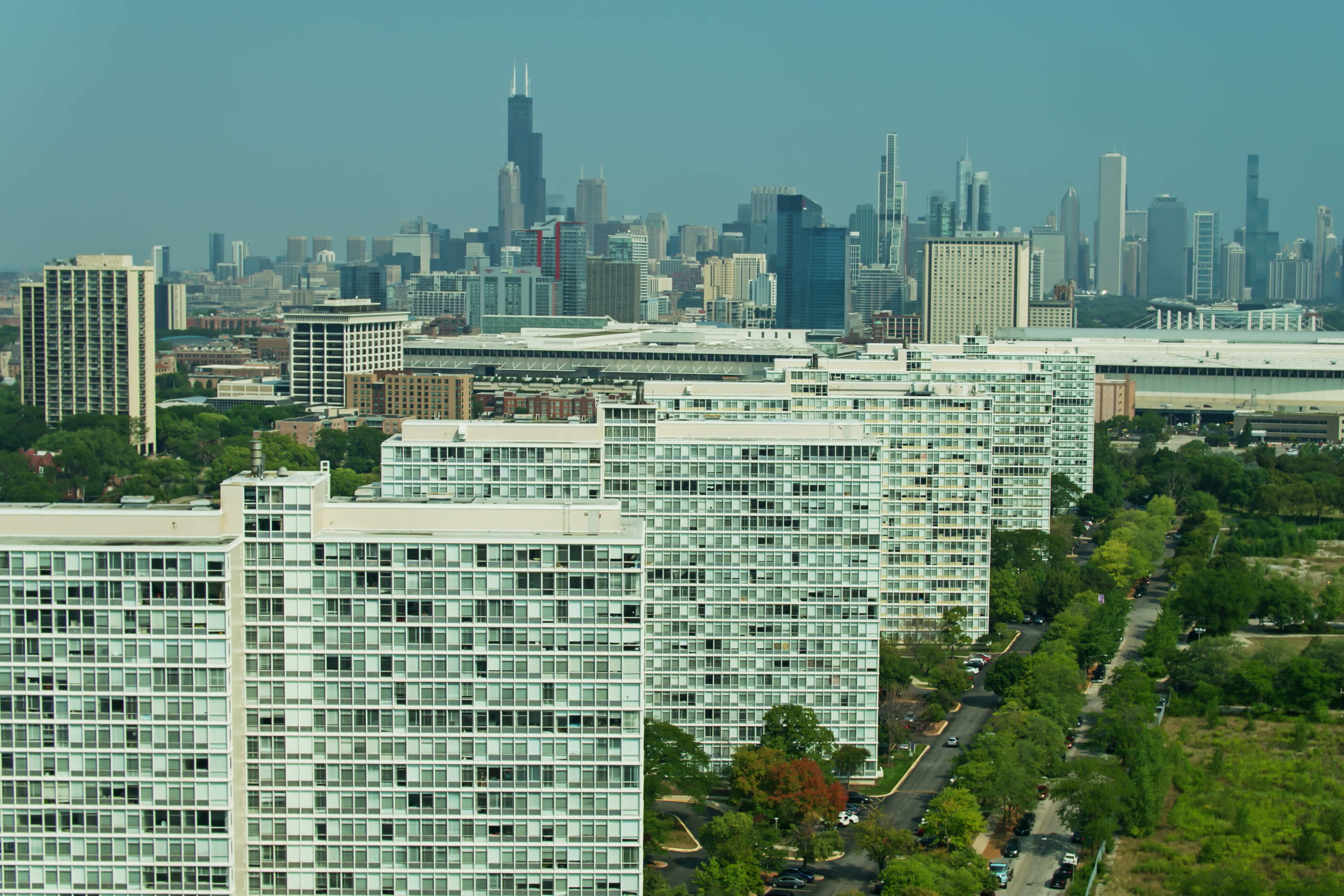 An aerial over Bronzeville, past the Prairie Shores apartment buildings