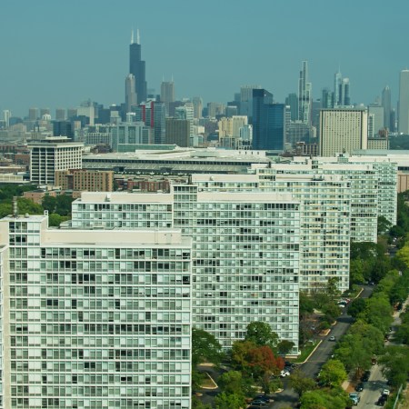 An aerial over Bronzeville, past the Prairie Shores apartment buildings