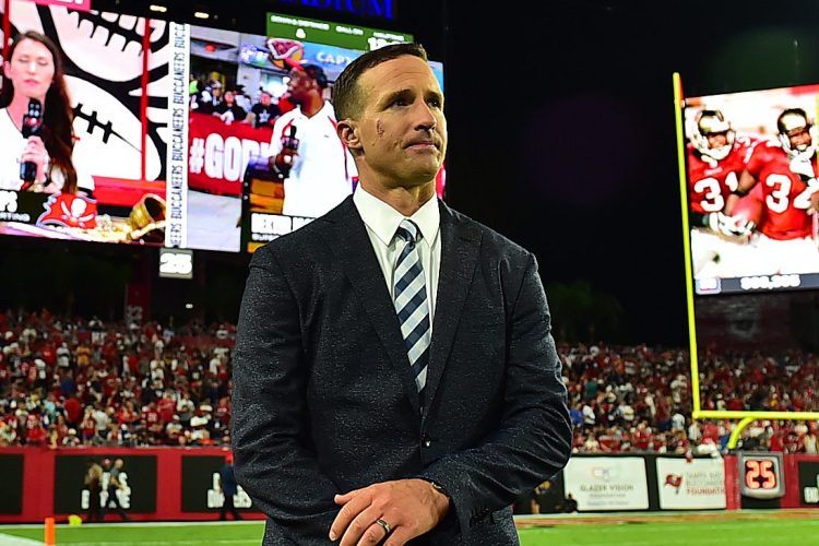 Drew Brees stands on the sideline at Raymond James Stadium in Tampa