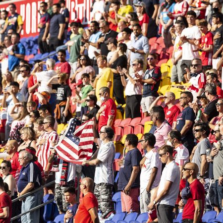 MLS fans in New Jersey wave the American flag during the national anthem