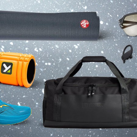 A collage of Fitness gifts on a steely grey flecked background