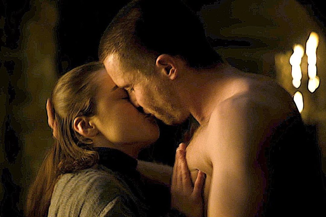 Maisie Williams as Arya Stark and Joe Dempsie as Gendry kiss in a scene from "Game of Thrones"