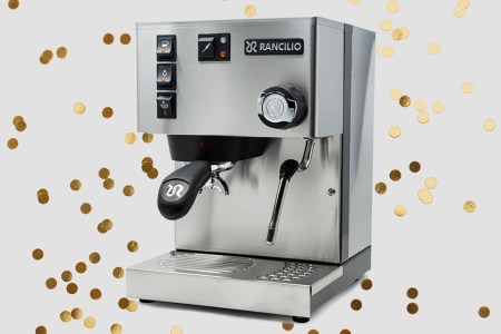 The Italian-made Rancilio Silvia espresso machine, the perfect holiday gift for 2021, on a grey background with gold glitter