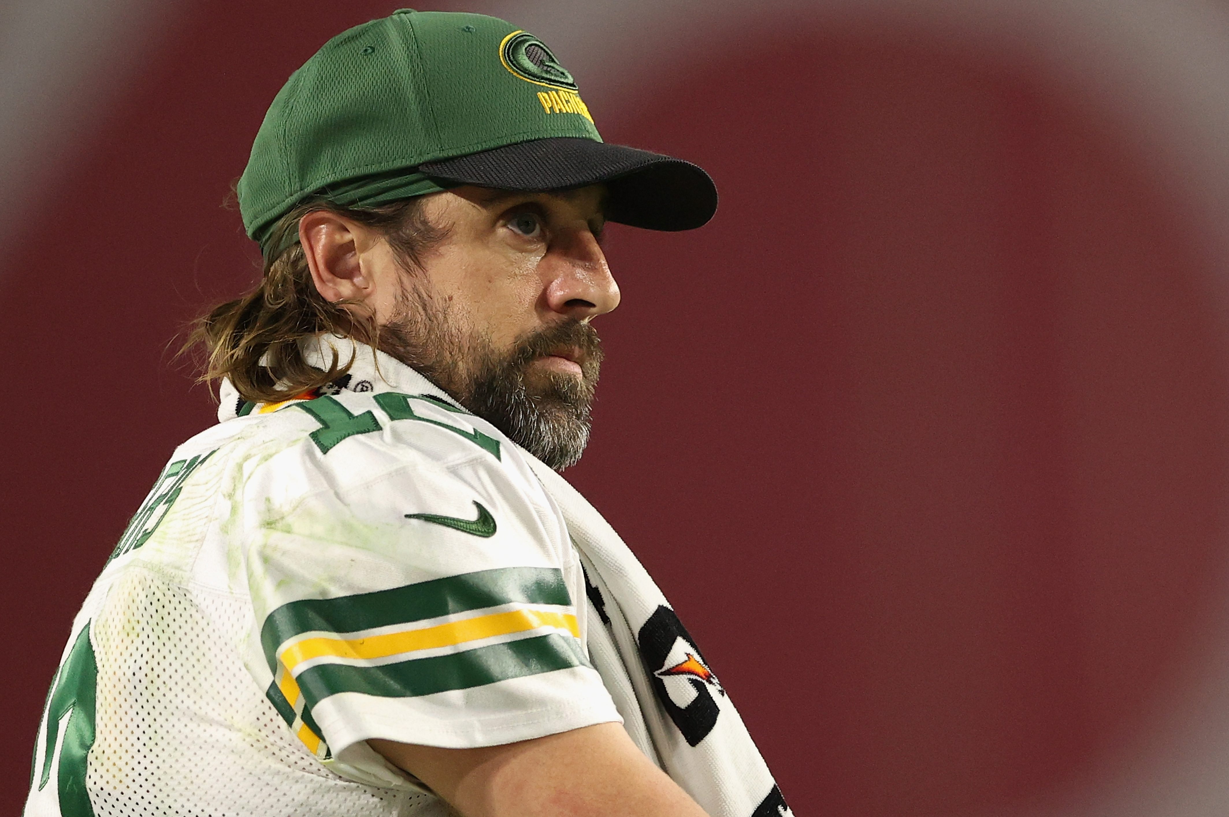 Quarterback Aaron Rodgers watches from the sidelines during a game