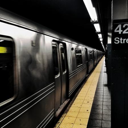 The Times Square Subway Station showing a train in the station and a sign reading "42 Street"