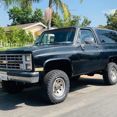 A 1988 Chevy K5 Blazer Silverado sitting on the curb in Los Angeles, California. Want to buy one of these classic SUVs? We asked Kyle Cheromcha what it's like owning one.