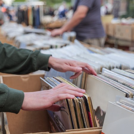 A shopper flipping through vinyl records at a record store