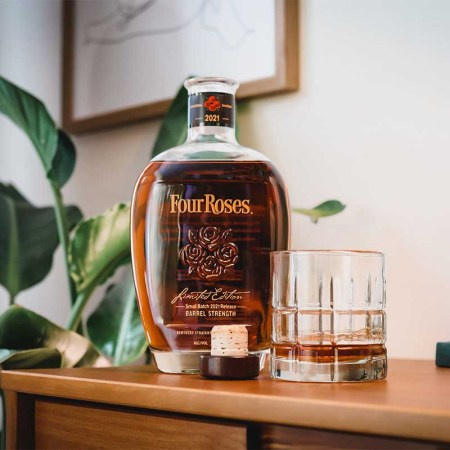 A bottle and a glass of Four Roses Small Batch 2021 Release Barrel Strength