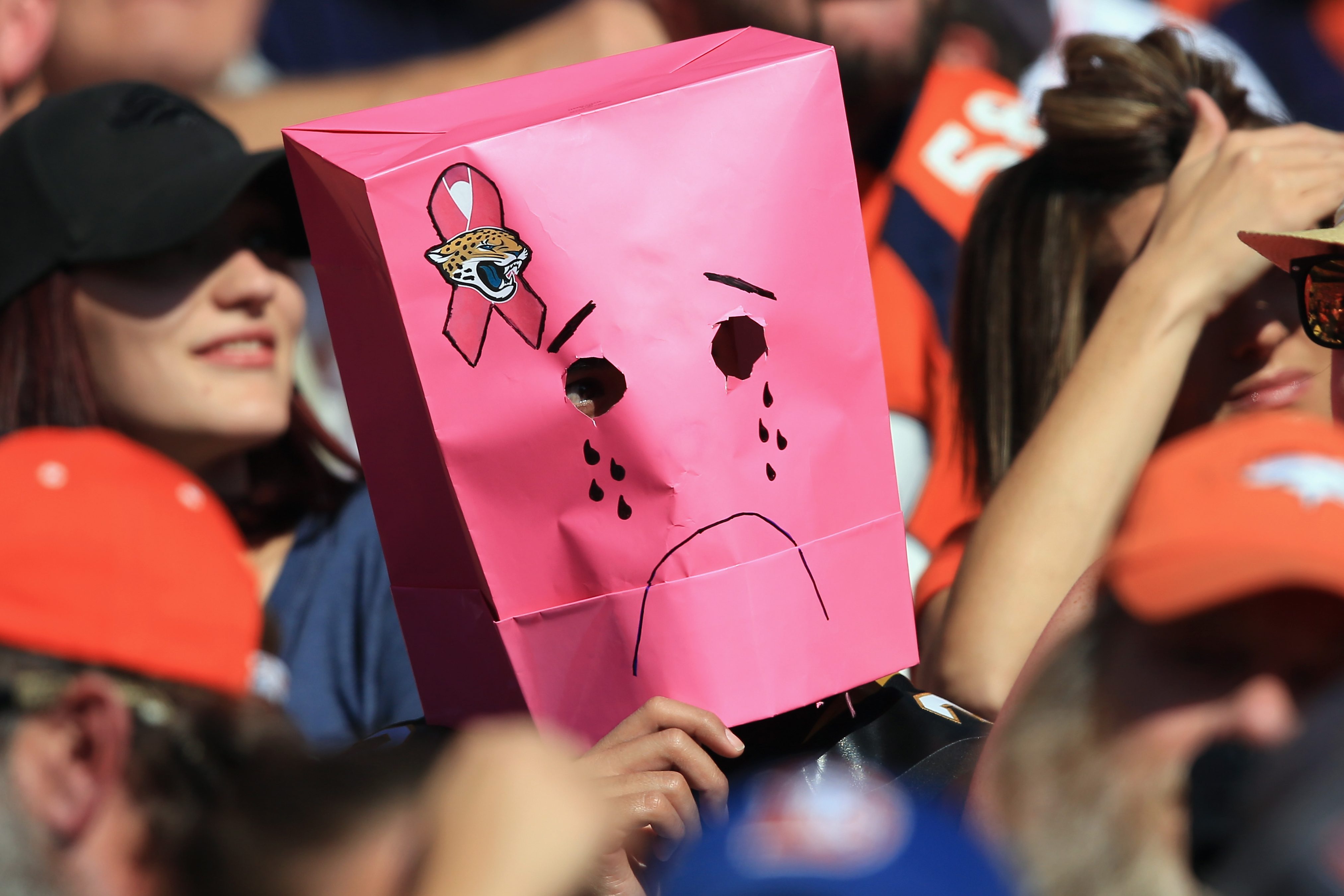 A Jacksonville Jaguars fan disguises himself with a bag over his head. According to one analysis, the Jaguars are the worst professional sports team of 2021.