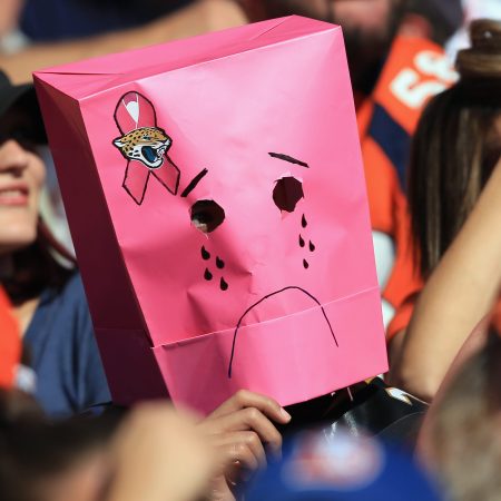 A Jacksonville Jaguars fan disguises himself with a bag over his head. According to one analysis, the Jaguars are the worst professional sports team of 2021.