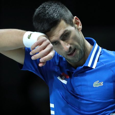 Novak Djokovic of Serbia wipes away sweat during a Davis Cup semifinal match