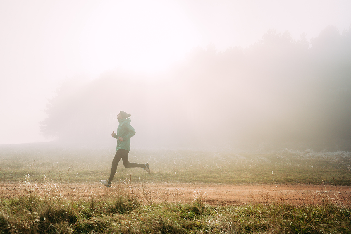 A man running through the fog.