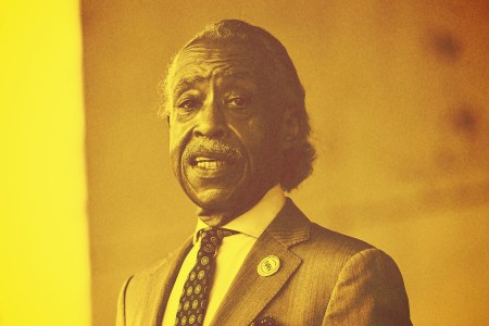 Al Sharpton in a noch lapel jacket and tie