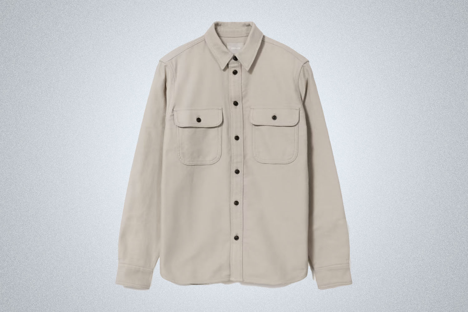 a grey-tan Everlane Shirt Jacket on a grey background