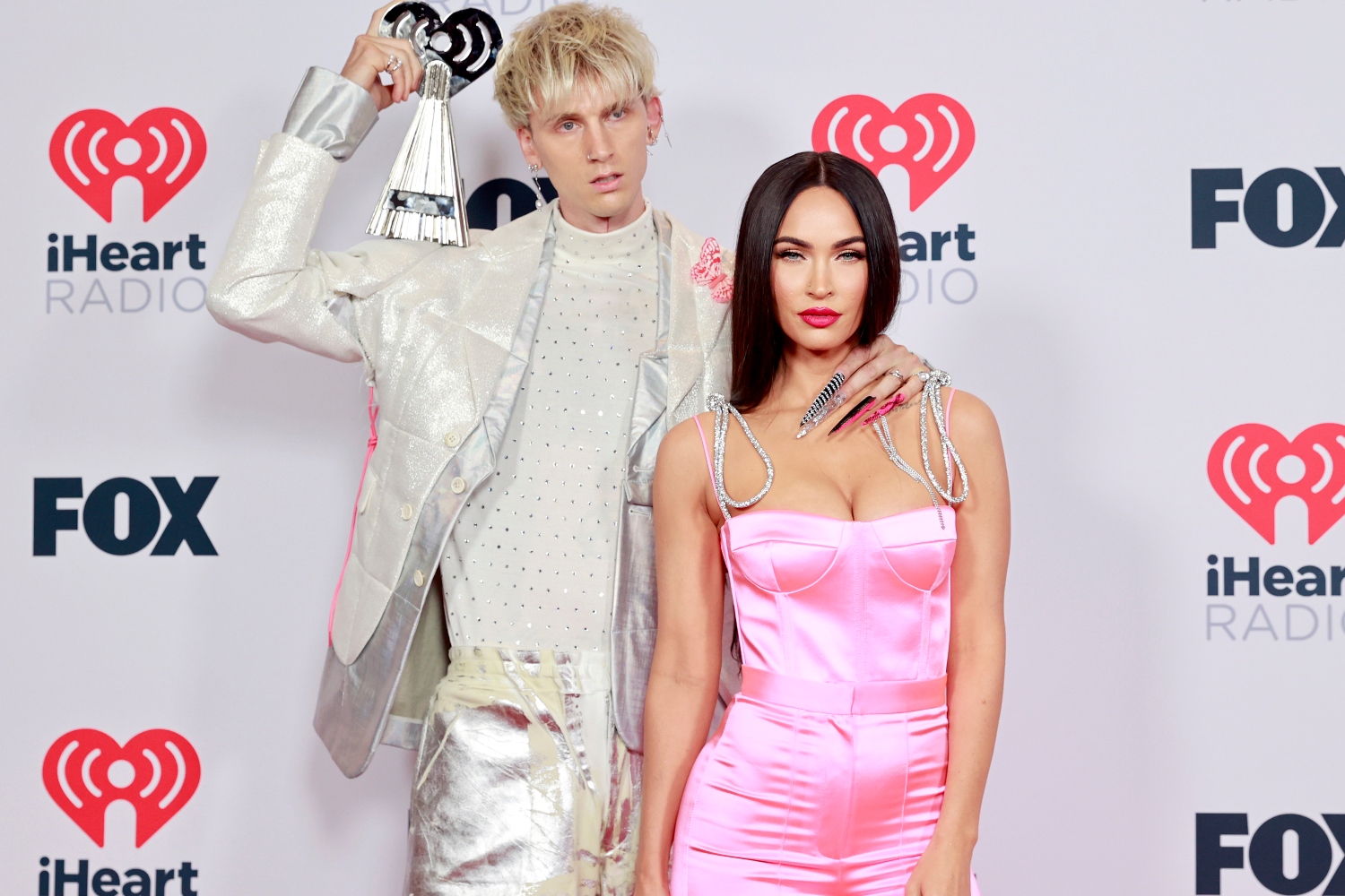 Machine Gun Kelly, winner of the Alternative Rock Album of the Year award for 'Tickets To My Downfall,’ and Megan Fox attend the 2021 iHeartRadio Music Awards at The Dolby Theatre in Los Angeles, California, which was broadcast live on FOX on May 27, 2021.