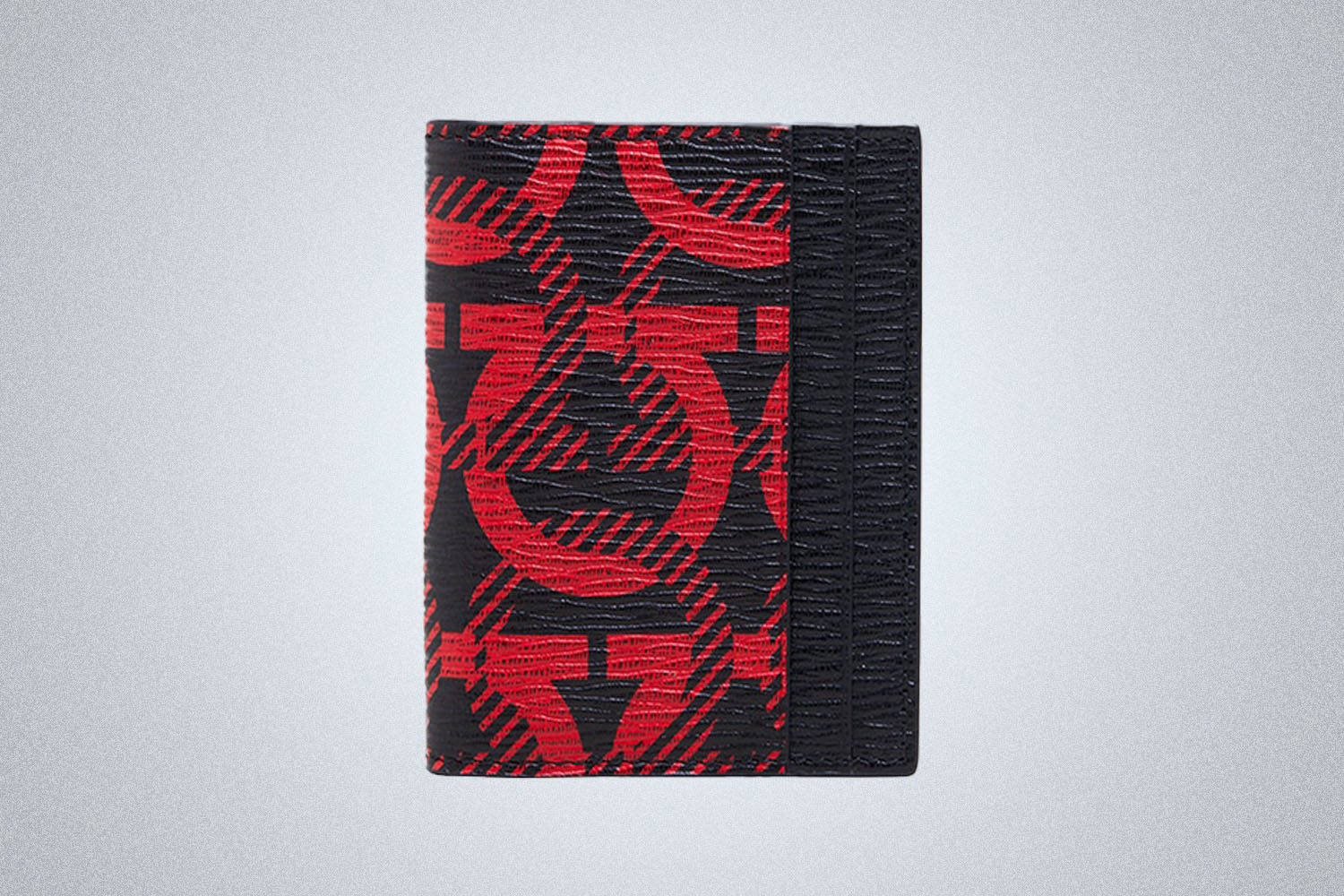 a red and black patterned Credit Card holder.