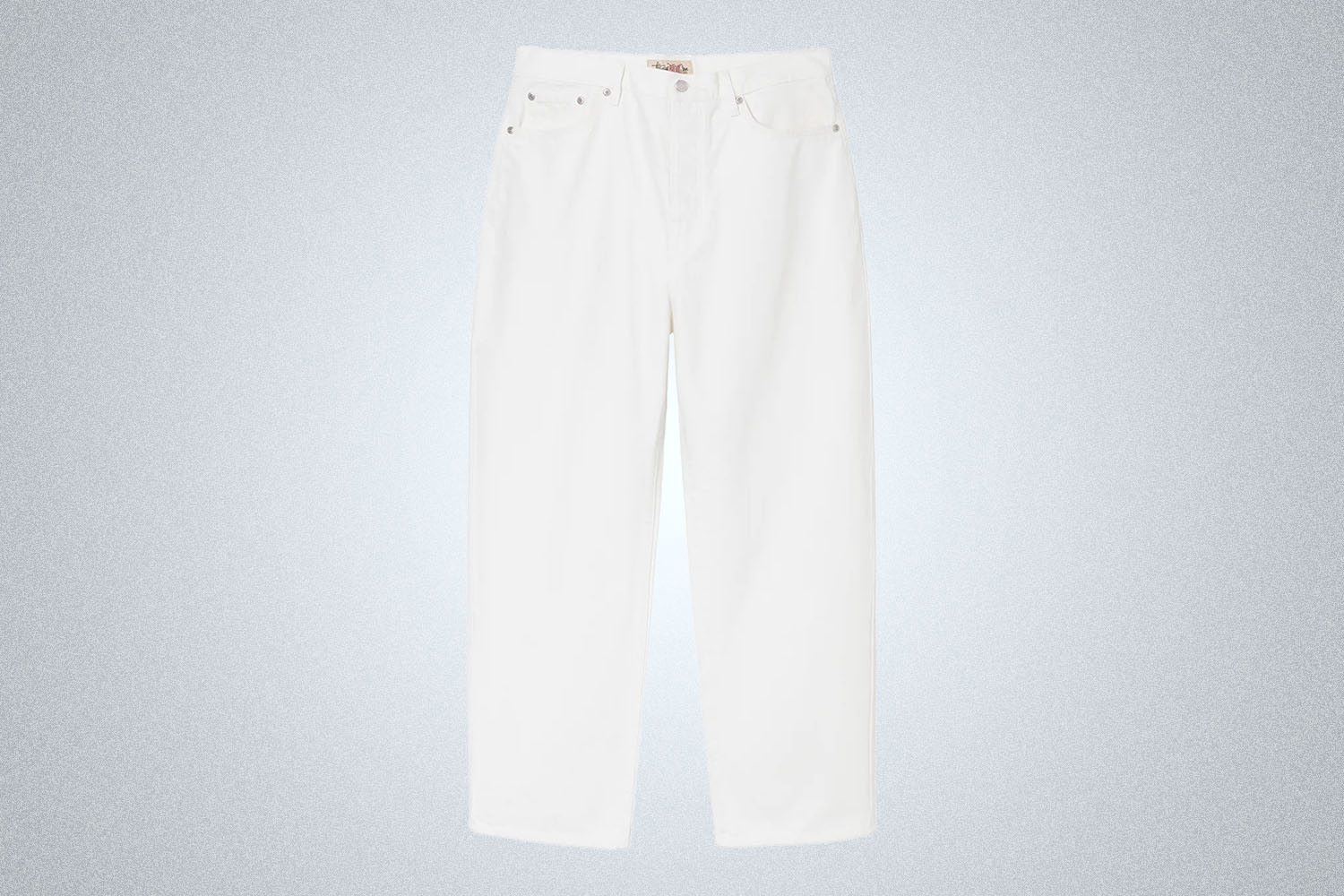 a pair of big white denim jeans from Stussy on a grey background