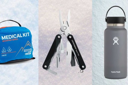 Medical kit, Leatherman Multitool and a Hydro Flask bottle, on a snowy background