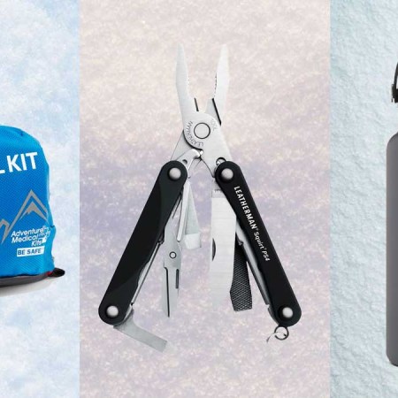 Medical kit, Leatherman Multitool and a Hydro Flask bottle, on a snowy background