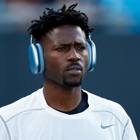 Antonio Brown warms up before the against the Carolina Panthers. Brown claims the Bucs offered him $200k in hush money to enter the "Crazy House" for mental health treatment