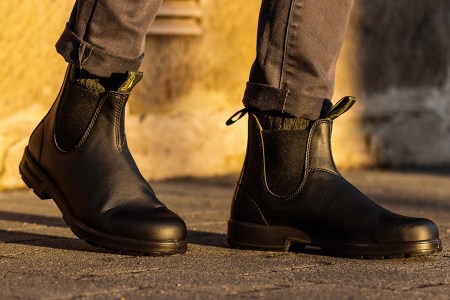 A man wearing Blundstone's #2115 Chelsea boots in black, the brand's first-ever vegan boots. We tested and reviewed them to see if they live up to the classic Blundstone #500.