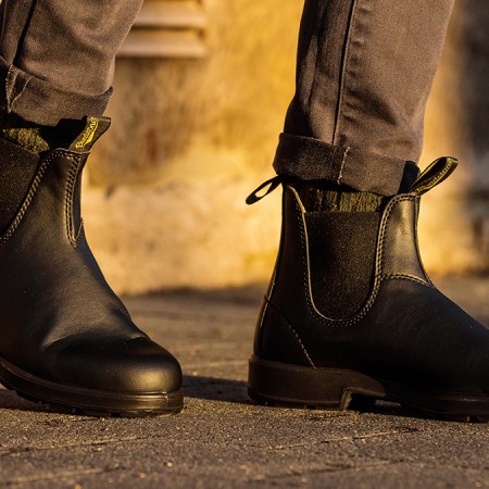 A man wearing Blundstone's #2115 Chelsea boots in black, the brand's first-ever vegan boots. We tested and reviewed them to see if they live up to the classic Blundstone #500.