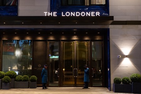 Two "quintessentially British" doormen stand guard at the Londoner Hotel