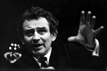 Author Norman Mailer pictured in a black and white photograph at a discussion in the Mayfair Theater in London