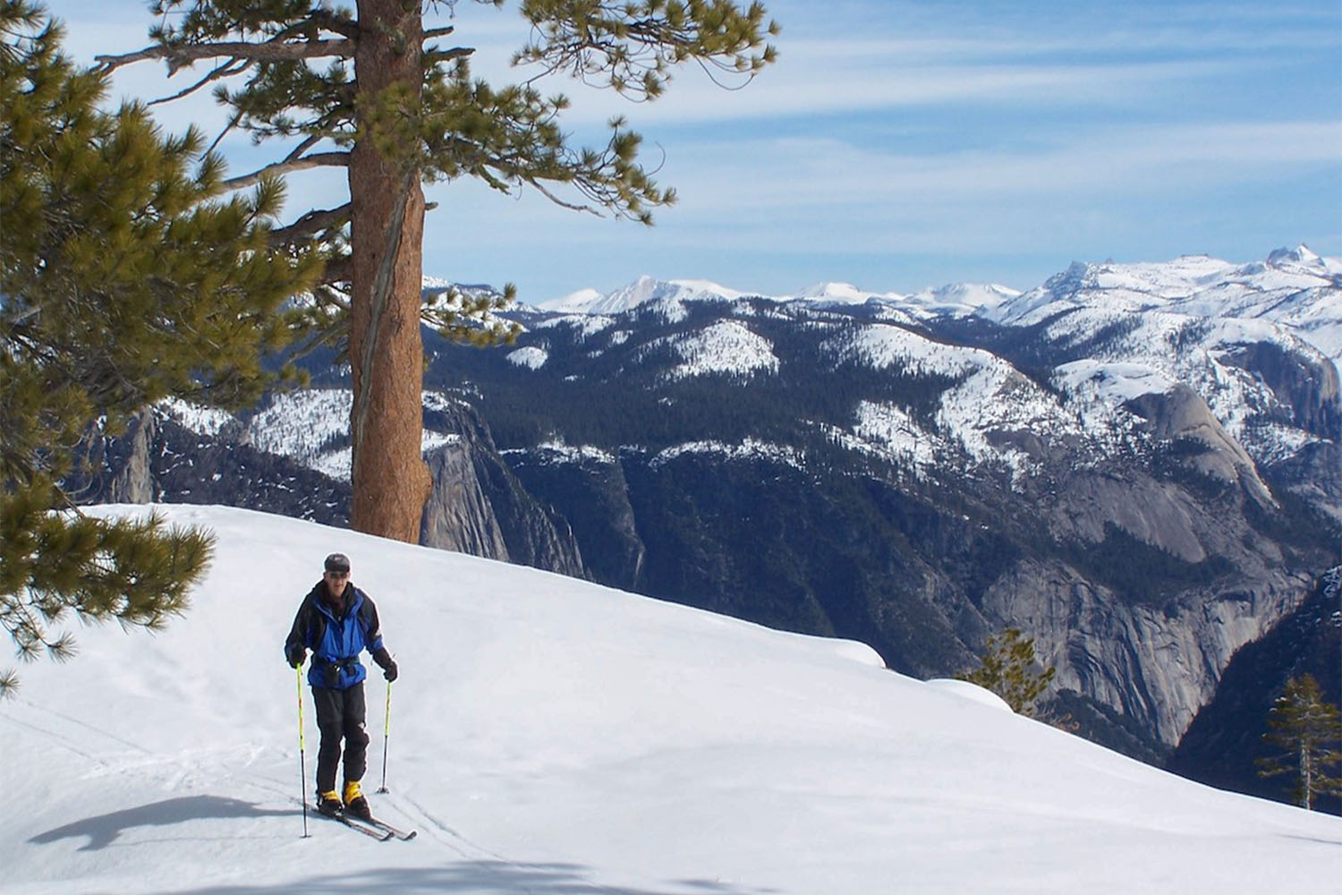 A photo of a skier and mountains cape