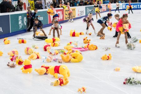 Children collect stuffed toy bears from the ice after Japan's Yuzuru Hanyu performed his routine in the men's short program at the Rostelecom Cup 2017 ISU Grand Prix.