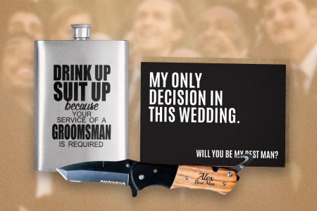 A flask, groomsmen proposal card and pocket knife in front of a line of groomsmen.