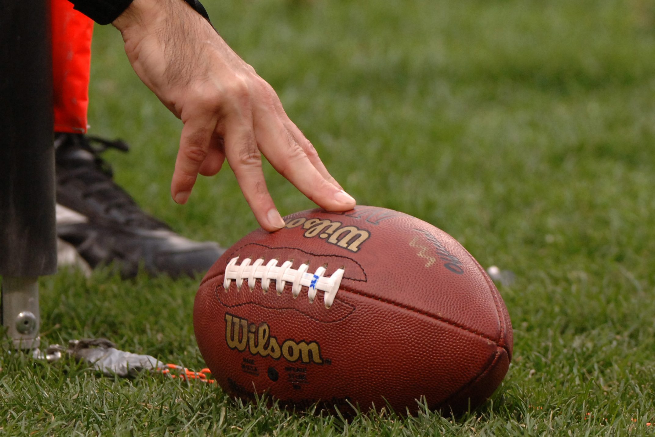 NFL officials bring out the chains and measure for a first down.