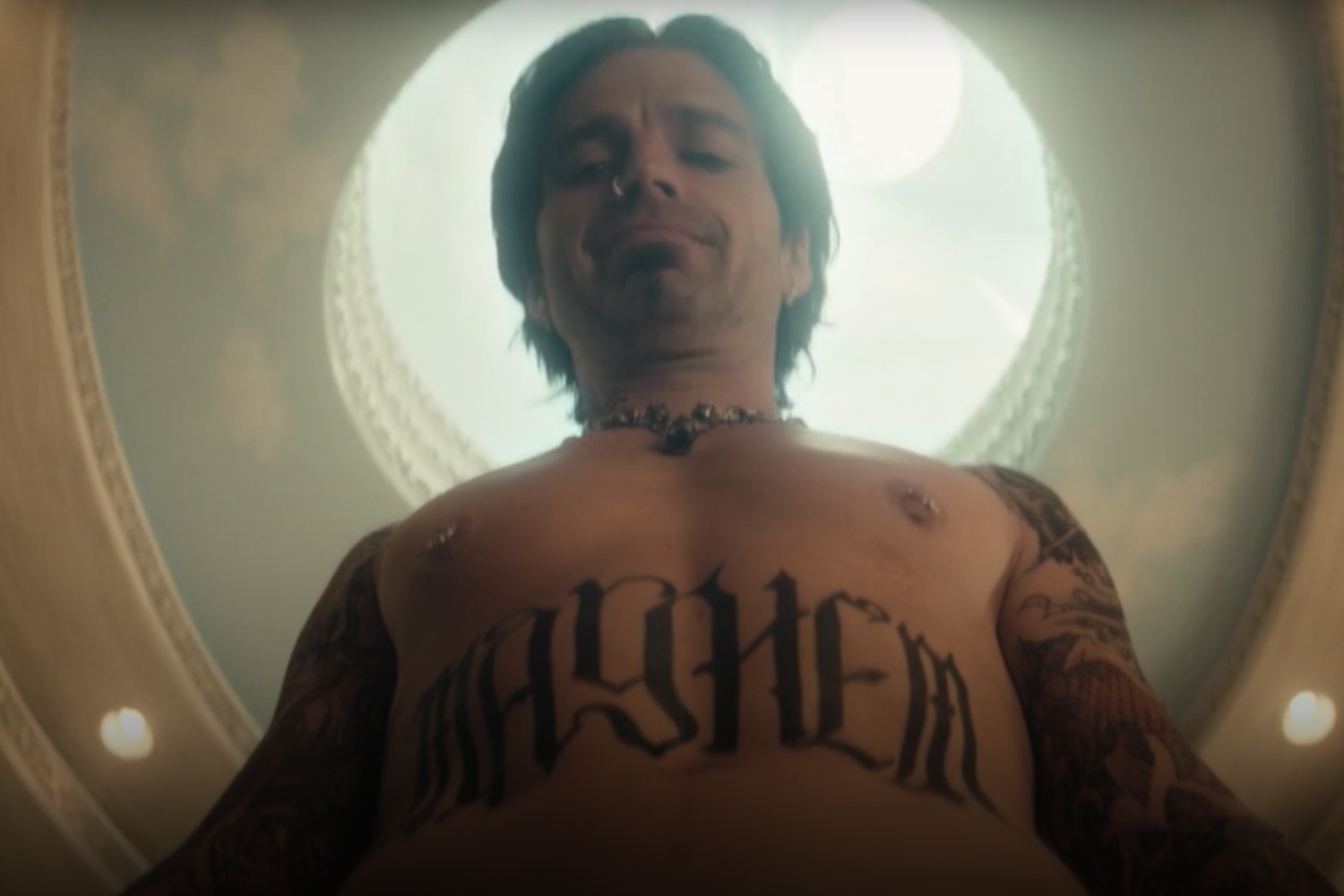 Tommy Lee (played by Sebastian Stan) gazes down upon his talking penis in this screenshot from Hulu's "Pam & Tommy"