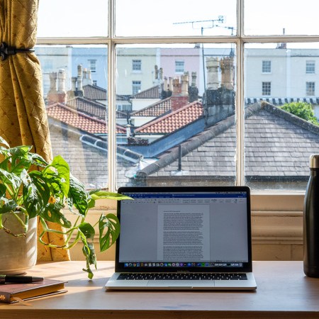 A desk facing a window.