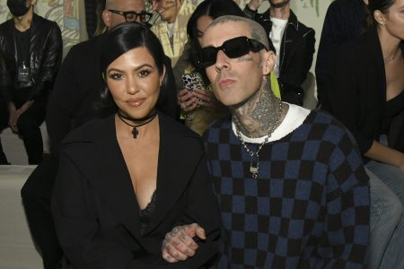 Kourtney Kardashian and Travis Barker attend the AMIRI Autumn-Winter 2022 Runway Show on February 08, 2022 in Los Angeles, California.