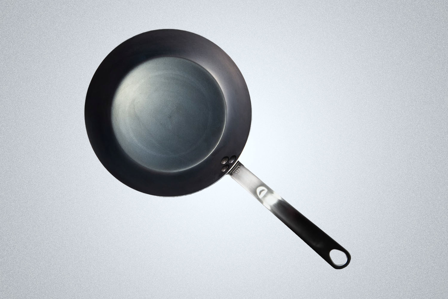 a Blue Carbon Skillet on a grey background 