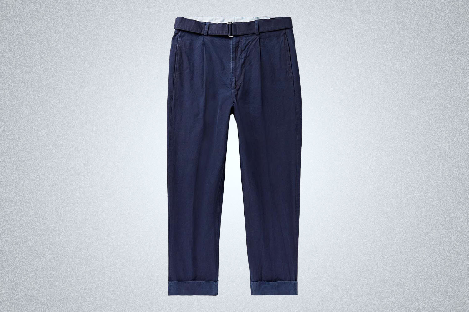 a pair of navy Officine Generale chinos on a grey background