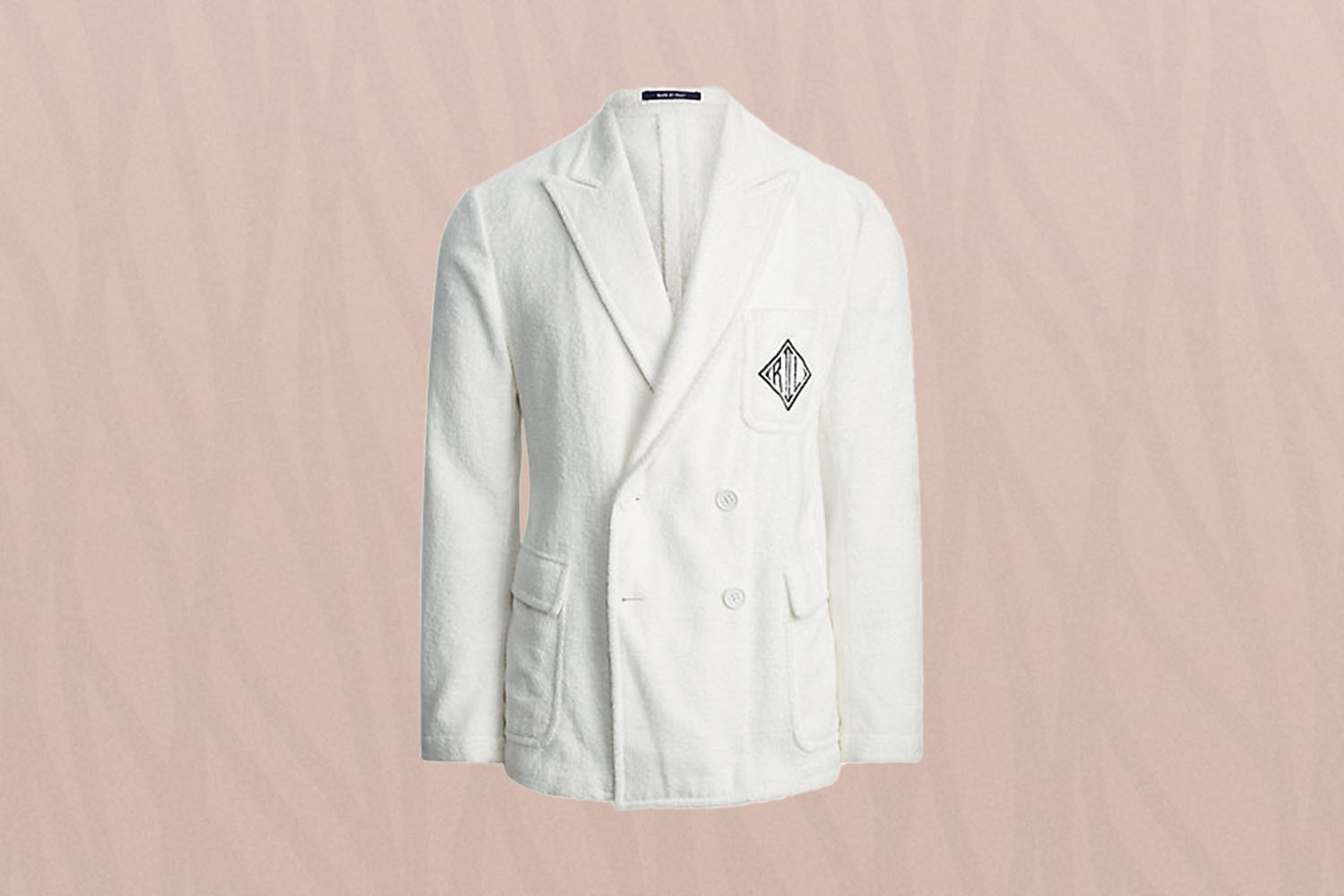 A white terrycloth blazer on a pink background