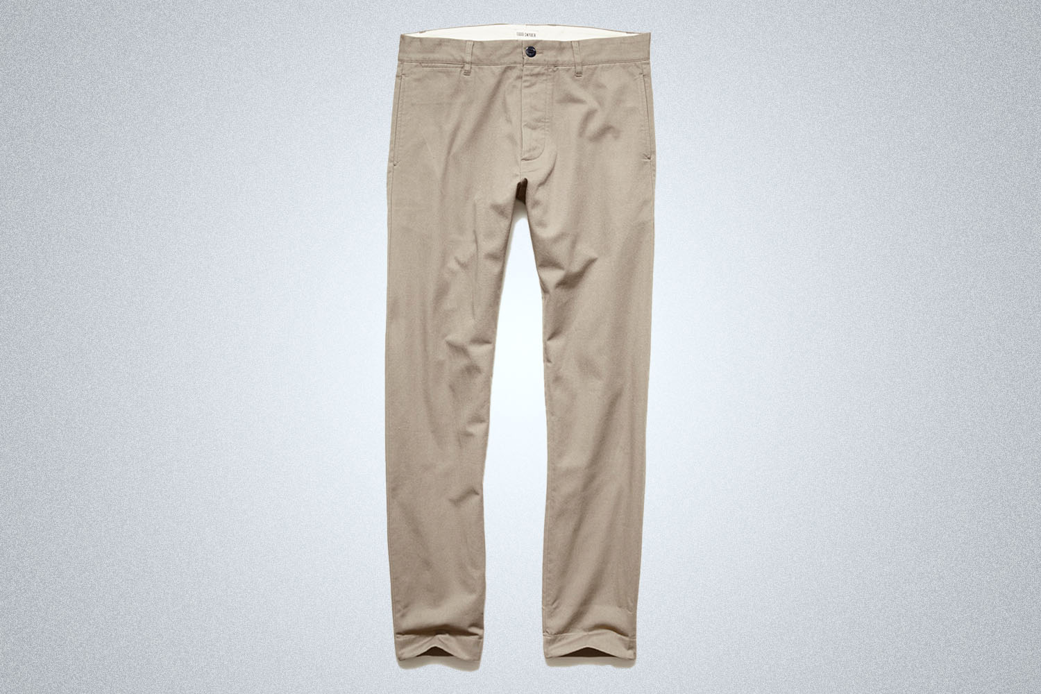 a pair of chinos on a grey background